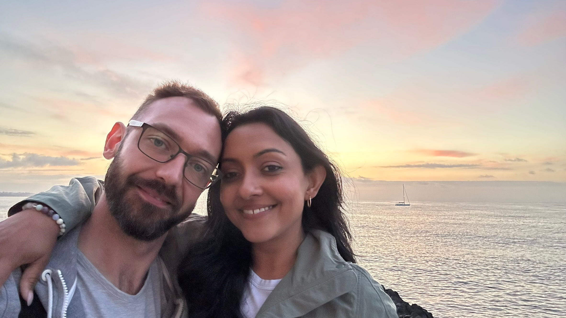 Kari and Anton selfie at sunset by the ocean